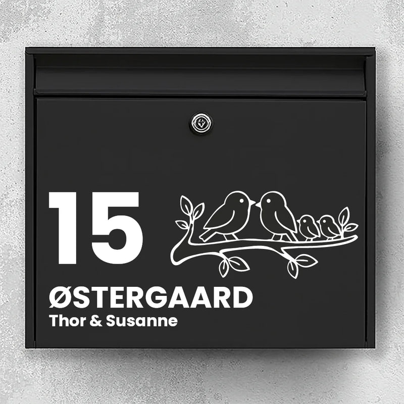 Postkasseklistremerke med fugler på gren